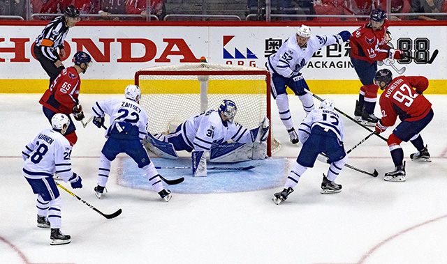 Playing hockey in front of the net