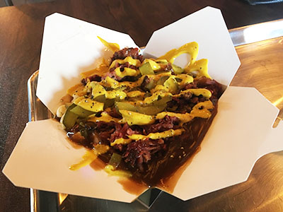 Poutine with pickles and mustard