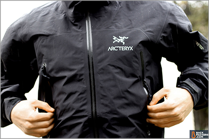 A man wearing a black Arc'teryx jacket