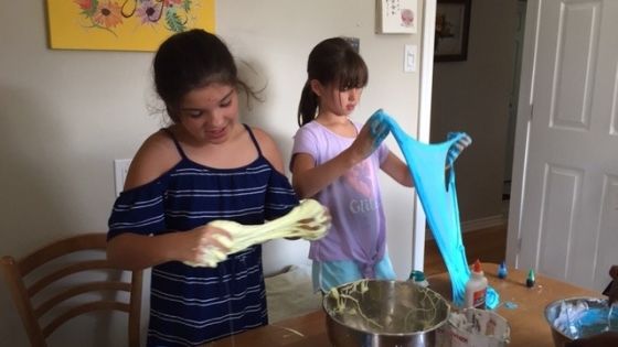 two girls making slime