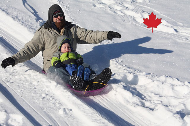 a man and son sledding